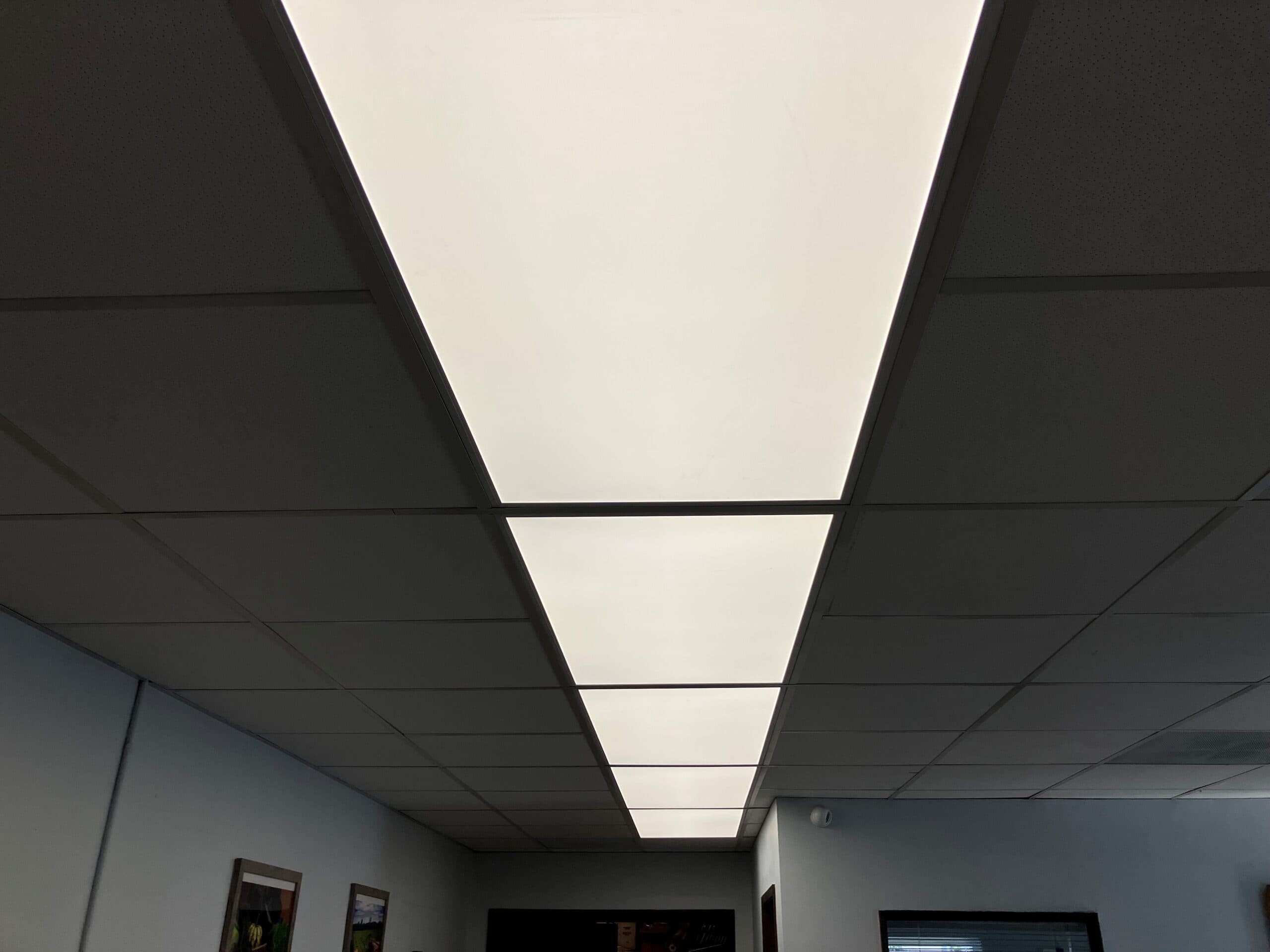 Backlit LED flat panels in a suspended ceiling grid